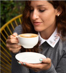 Woman Holding A Hot Drink Photo